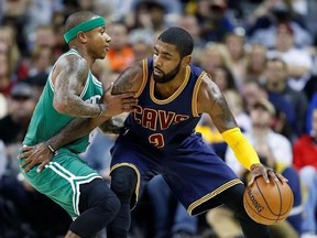 FILE - In this Nov. 3, 2016, file photo, Cleveland Cavaliers&#039; Kyrie Irving, right, looks to drive against Boston Celtics&#039; Isaiah Thomas during the first half of an NBA basketball game in Cleveland. Irving, who asked Cavaliers owner Dan Gilbert to trade him earlier this summer, could be on his way to Boston as the Cavaliers are in serious negotiations with the Celtics about swapping him for point guard Thomas. Since Irving made his stunning request, the defending Eastern Conference champions have