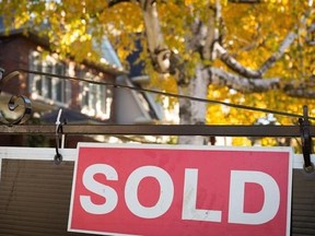 A real estate sold sign hangs in front of a west-end Toronto property, Friday, Nov. 4, 2016. The Ontario Real Estate Association says it&#039;s time for higher fines for real estate agents that break the rules.The association is proposing that the fines for salespeople who violate a code of ethics double to $50,000.THE CANADIAN PRESS/Graeme Roy