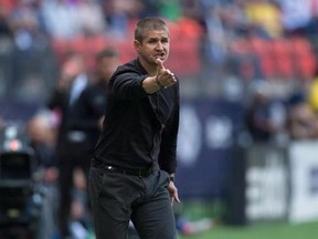 Vancouver Whitecaps&#039; head coach Carl Robinson argues a call with the referee before being ejected from the pitch during first half MLS soccer action against the New York Red Bulls in Vancouver on September 3, 2016. Before his Vancouver Whitecaps even stepped on the pitch Wednesday against the Seattle Sounders, head coach Carl Robinson already had one eye on his team&#039;s next match - and was dreading it. Not because of the opponent, but rather the long trek just to get there. &ampquot;(It&#039;s) like going to