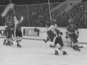 Paul Henderson and Bobby Clarke of Team Canada celebrate Henderson's series-winning goal in Game 8 of the 1972 Summit Series between Canada and the Soviet Union at the Luzhniki Ice Palace in Moscow.
