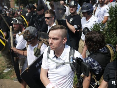 CHARLOTTESVILLE, VA - AUGUST 12:  White nationalists, neo-Nazis and members of the "alt-right" exchange insluts with counter-protesters as they attempt to guard the entrance to Lee Park during the "Unite the Right" rally August 12, 2017 in Charlottesville, Virginia. After clashes with anti-fascist protesters and police the rally was declared an unlawful gathering and people were forced out of Lee Park, where a statue of Confederate General Robert E. Lee is slated to be removed. 
(EDITORS Chip Somodevilla, Getty Images