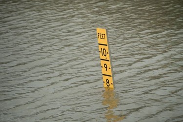 A sign indicates the height of floodwater on Route 288 during the aftermath of Hurricane Harvey August 27, 2017 in Houston, Texas.