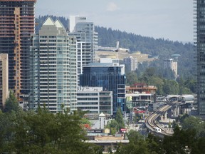 Construction continues along the skytrain corridor near the Brentwood tower development.