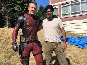 Deadpool star Ryan Reynolds poses with Canadian Defence Minister Harjit Sajjan on the set of Deadpool 2 Monday.