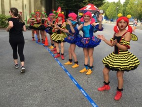 Costumed bees were all the buzz on Sunday morning as they cheered on runners in the third annual PNE Donut Dash 5K.