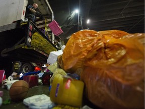 VANCOUVER, B.C.: December 23, 2016 –  A man unloads garbage at the Vancouver South Transfer Station, Vancouver, December 23 2016.