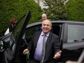 B.C. NDP leader John Horgan leaves with B.C. Green party leader Andrew Weaver from Government House after dropping of a signed document by 44 MLAs showing theres an agreement between the two parties in Victoria, B.C., on Wednesday, May 31, 2017.