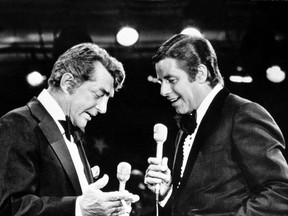 In this Sept. 7, 1976, file photo, entertainers Dean Martin, left, and Jerry Lewis appear together on Lewis's annual telethon for the Muscular Dystrophy Association in Las Vegas, Nev. Lewis, the manic, rubber-faced showman who jumped and hollered to fame in a lucrative partnership with Martin, settled down to become a self-conscious screen auteur and found an even greater following as the tireless, teary host of the annual muscular dystrophy telethons, has died. He was 91.