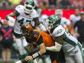 B.C. Lions #9 Alex Ross is tackled by Saskatchewan Roughriders #98 Ese Mrabure in a regular season CHL football game at BC Place Vancouver, August 05 2017.