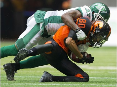 BC Lions #80 Chris Williams is tackled by Saskatchewan Roughriders #1 Jovon Johnson in a regular season CHL football game at BC Place Vancouver, August 05 2017.