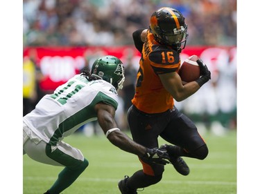 BC Lions #16 Brian Burnham wheels around Saskatchewan Roughriders #11 Ed Gainey in a regular season CHL football game at BC Place Vancouver, August 05 2017.