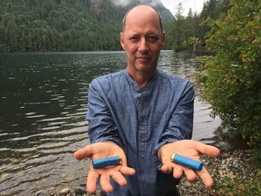 Aggasiz-based biologist Mike Pearson holds up shotgun shells found on the beach at Davis Lake Provincial Park northeast of Mission.