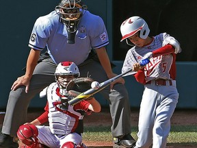 Japan's Yuya Nakajima hits a three-run home run off White Rock pitcher Ben Chowen in the fourth inning at the Little League World Series tournament in South Williamsport, Pa.