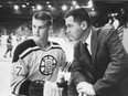 Rookie Bobby Orr talks with his Boston Bruins coach Harry Sinden in 1966.