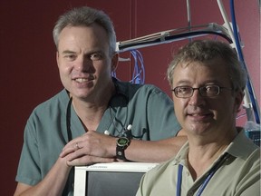 Mark Ansermino, left, and Guy Dumont were working on a device in 2005 to aid people monitoring patients during surgery.