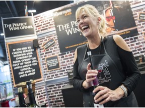 Denise Duncan, professional pitchwoman/vendor at the Vineyard Elite booth pitches the Perfect Wine Opener, at the PNE Forum marketplace, Vancouver, August 25 2017.