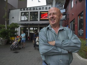 David McCann outside his Granville Island office and the chocolate shop from which he ordered 2,000 treats for the VPD for their willingness to change over the years the way they approach Vancouver's gay community.