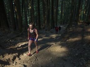 A hiker on the popular Grouse Grind trail on Wednesday. Metro Vancouver is hoping to meet with the new owners of the Grouse Mountain Resort about trail upkeep. The trail runs through regional district land to the business at the top of the mountain.