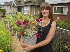 Rose Dykstra in the front yard of her Vancouver home on Aug. 5. Dykstra uses her front yard, and that of a neighbour, to grow flowers for her business, Front Yard Flower Co.