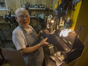 Cobbler Henry Ng is 90-years-old and retiring from a lifetime spent repairing shoes and leather goods. Ng is seen Aug. 30 in Vancouver at his Main Street shoe-repair business.