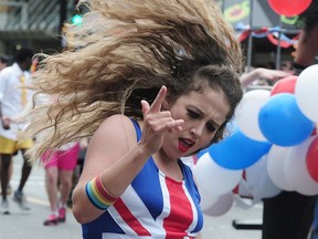 A participant dances in the 2016 Pride Parade in Vancouver.