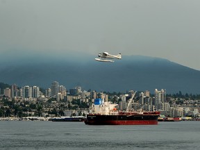 Hazy conditions over the North Shore mountains as Environment Canada issue an air quality advisory was winds carry smoke from wildfires burning in B.C.'s interior to the province's south coast, in Vancouver, BC., August 1, 2017.