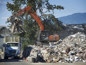 Work goes on outside Bright Sky Disposal on 116 Avenue at Surrey in August 2016.