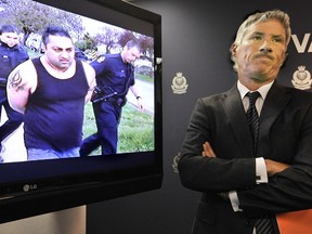 Insp. Mike Porteous with a video of the arrests that in 2009 'functionally dismantled' one of the gangs dubbed the Sanghera Crime Group. Here, Boby Sanghera is arrested.