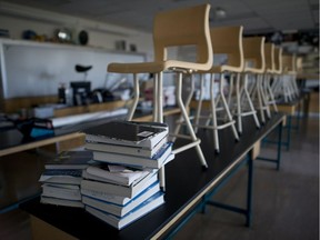 Chairs are seen on top of desks in a physics lab at Magee Secondary at Vancouver in September 2014. In 2017, there is still an oversupply of teachers in Canada, but the supply isn't distributed in a manner that — in the short run — can satisfy the demand.