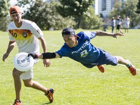 An Ultimate Frisbee player makes a dive for it at a recent game.