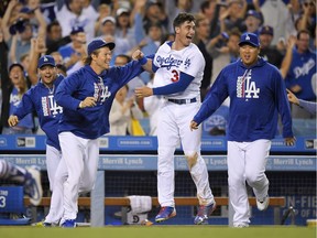 It’s been that kind of season for the L.A. Dodgers, seen here celebrating a ninth-inning victory over Chicago White Sox last week, one of 90 wins the club has registered so far this season.