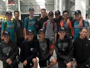 Members of the White Rock Little League team wait for their flight from Toronto to Newark, N.J., where they'll board a bus to take them to the Little League World Series in Williamsport, Penn.