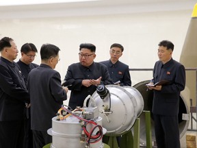 In this undated image distributed on Sunday, Sept. 3, 2017, by the North Korean government, shows North Korean leader Kim Jong Un at an undisclosed location. North Koreas state media on Sunday, Sept 3, 2017, said leader Kim Jong Un inspected the loading of a hydrogen bomb into a new intercontinental ballistic missile, a claim to technological mastery that some outside experts will doubt but that will raise already high worries on the Korean Peninsula. Independent journalists were not given access to cover the event depicted in this image distributed by the North Korean government. The content of this image is as provided and cannot be independently verified. (Korean Central News Agency/Korea News Service via AP)