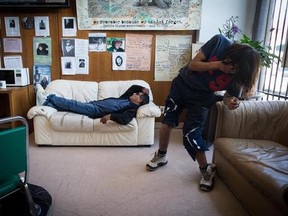 A man struggles to walk as another listens while lying on a couch during a meeting of the B.C. Association of People on Methadone in the Downtown Eastside of Vancouver, B.C., on Wednesday August 30, 2017. Drug users trying to quit heroin are gathered for a meeting in Vancouver with one mission in mind: to support each other through the struggles of a reformulated treatment drug they say hasn&#039;t worked and has instead contributed to the opioid epidemic. THE CANADIAN PRESS/Darryl Dyck