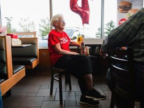 FILE - In a Friday, March 24, 2017, file photo, Loraine Maurerchats visits with customers at the N. Green River McDonald&#039;s location in Evansville, Ind., where a celebration was held in recognition of her more than four decades of work at local McDonald&#039;s restaurants. More Americans age 65 and over are still punching the clock, and the last time the percentage was this high was when John F. Kennedy was in the White House. In April 2017, 19 percent of Americans age 65 and over were still working,