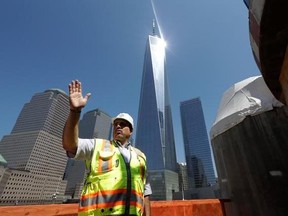 In this Aug. 10, 2017 photo, Jerry Dimitriou, executive director of the Greek Orthodox Archdiocese of America, describes the construction progress at the St. Nicholas National Shrine in New York. The Greek Orthodox church, taking shape across from the World Trade Center memorial plaza, will glow at night like a marble beacon when it opens sometime next year. It also will mark another step in the long rebuilding of New York&#039;s ground zero. (AP Photo/Mark Lennihan)