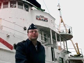 FILE- In this May 30, 2000, file photo, U.S. Coast Guard Lt. William Moeller of Northford, Conn., poses for a photo in front of the USS Tamaroa. Moeller was aboard the Tamaroa during the 1991 rescue of five Air National Guardsmen who ditched their helicopter as they were trying to rescue the crew of a fishing boat during a fierce storm. The storm and the events surrounding it were recalled in the book &ampquot;The Perfect Storm&ampquot; which was made into a motion picture. Officials say they plan to sink the s