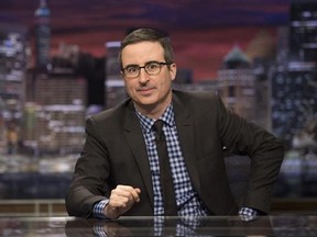 This image released by HBO shows John Oliver, host of &ampquot;Last Week Tonight with John Oliver.&ampquot; HBO says it has renewed the show for three additional seasons. (Eric Liebowitz/HBO via AP)