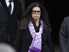 L'Oreal heiress Francoise Bettencourt-Meyers leaves after attending the funeral ceremony for French journalist Jacques Chancel at the Saint-Germain-des-Pres church in Paris on January 6, 2015.