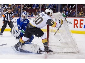 Tyler Wong of the Vegas Golden Knights celebrates after scoring a goal against goalie Richard Bachman.