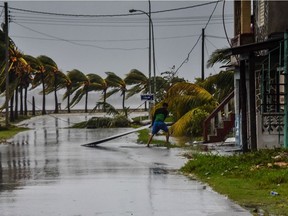 CUBA-HURRICANE-IRMA

Cubans retrieve their belongings after the passage of  Hurricane Irma in Caibarien, Villa Clara province, 330km east of Havana, on September 9, 2017. Irma's blast through the Cuban coastline weakened the storm to a Category Three, but it is still packing 125 mile-an-hour winds (205 kilometer per hour) and was expected to regain power before hitting the Florida Keys early Sunday, US forecasters said. The Cuban government extended its maximum state of alert to three additional provinces, including Havana, amid fears of flooding in low-lying areas. / AFP PHOTO / ADALBERTO ROQUEADALBERTO ROQUE/AFP/Getty Images
ADALBERTO ROQUE, AFP/Getty Images