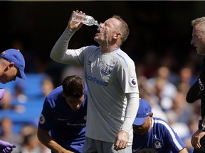 Everton's Wayne Rooney pours water on his face during the English Premier League soccer match between Chelsea and Everton at Stamford Bridge stadium in London last month.