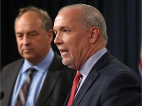 Premier John Horgan, right, and Green Leader Andrew Weaver.