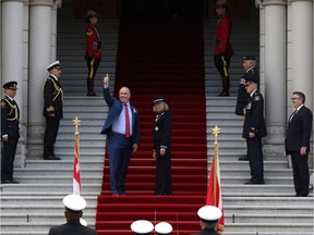 Premier John Horgan and Lt.-Gov. Judith Guichon meet on the steps of Legislature before the speech from the throne in the legislative assembly in Victoria, B.C., on Friday, September 8, 2017. THE CANADIAN PRESS/Chad Hipolito