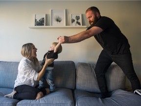 Blaine Neufeld swings son Kash into the arms of his wife Adrienne Neufeld. While money is tight, the South Surrey couple is putting aside money every month for Kash's post-secondary education.