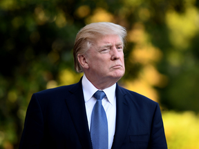 U.S. President Donald Trump heads toward the White House after his return from a golf trip to New Jersey on Sept. 24, 2017.