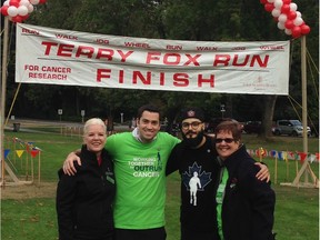 Participants in the 37th Terry Fox Run From left,Donna White, director of the Terry Fox Foundation in B.C. and the Yukon, participated in the run at Stanley Park in Vancouver. (L-R) White, accompanied by Josh Eckler, Johan Monterrat and Maureen Calder of the Four Seasons hotel who organized the run.  [PNG Merlin Archive]
PNG