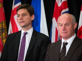 B.C. Attorney General David Eby, left, and B.C. Minister of Public Safety and Solicitor General Mike Farnworth listen during a news conference after a meeting of federal, provincial and territorial ministers responsible for justice and public safety, in Vancouver, B.C., on Friday September 15, 2017.