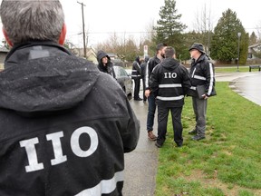 Newly sworn in IIO investigators at a mock scene next to and in Holland Park in Surrey. New IIO investigators work alongside senior IIO investigators.