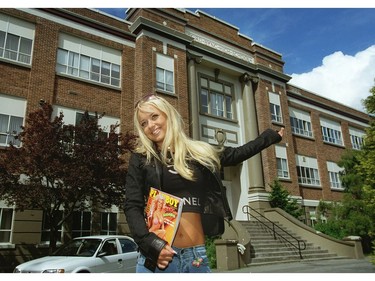 May 28, 2001: Playboy playmate Kimberley Stanfield poses in front of Lord Byng high school (her old school) were she chatted with friends after returning from a whirlwind tour of Europe with Playboy Magazine. Photo: Mark van Manen/Vancouver Sun